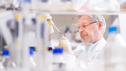 Senior+scientist+pipetting+with+foreground.jpg