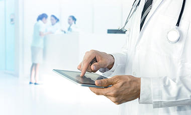 Healthcare analytics - man on ipad2.jpg